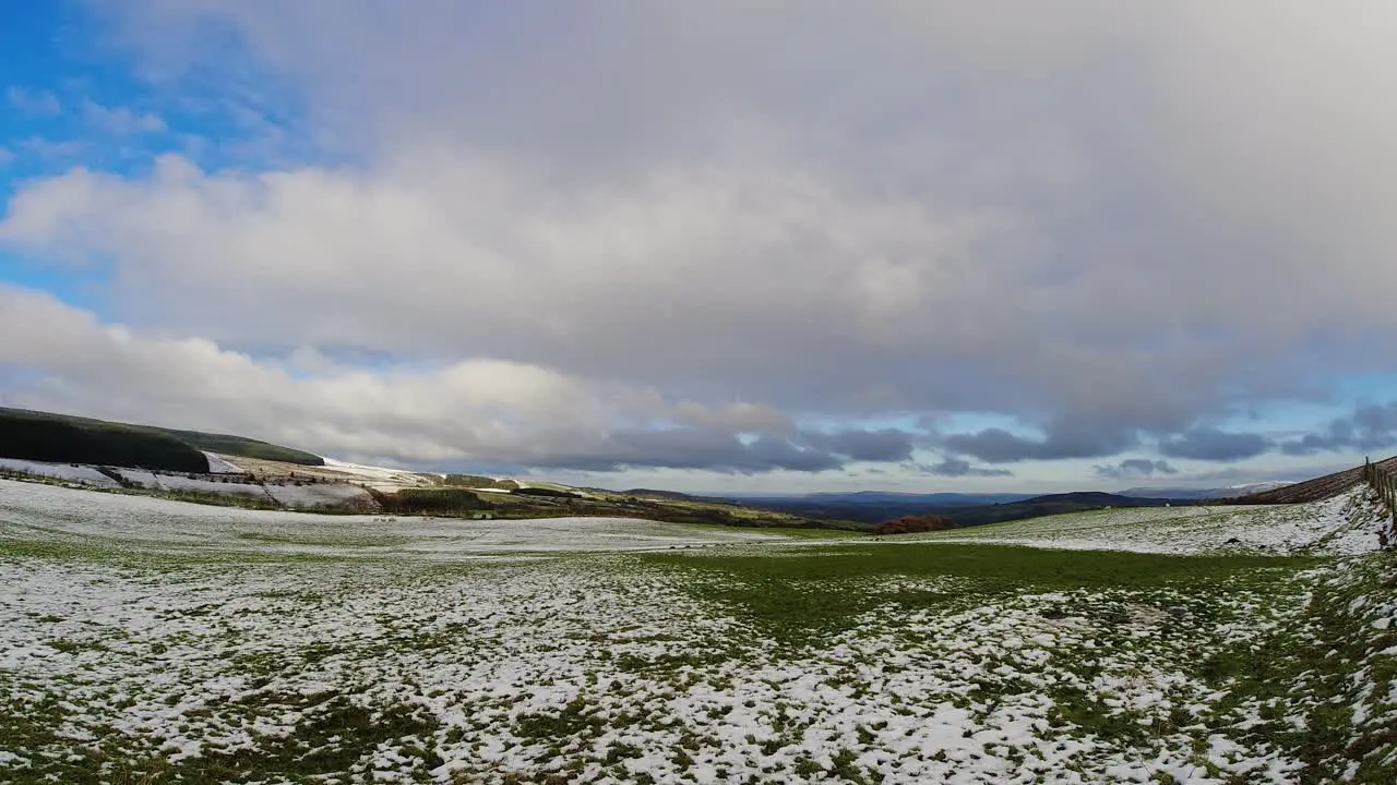 Snowy timelapse rural winter valley countryside cloudscape agricultural farmland landscape