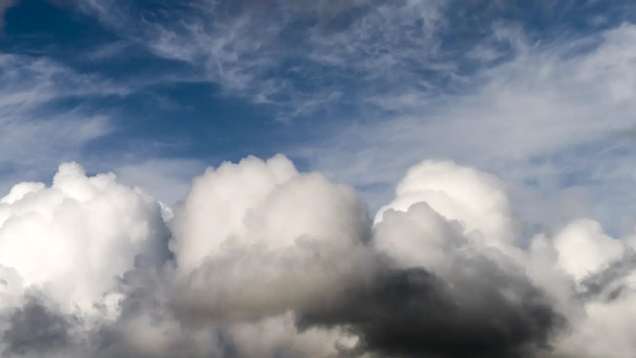 Timelapse of cumulus clouds rolling in blue sky