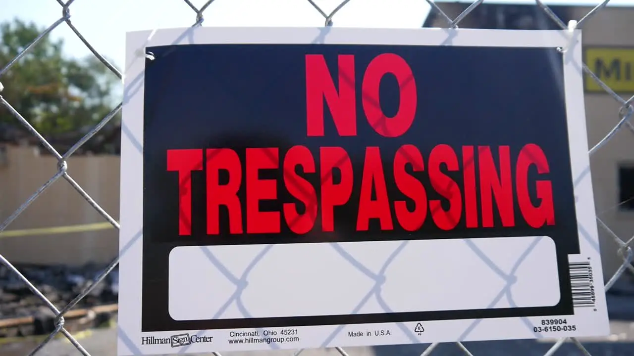 No trespassing in front of a burned-out building