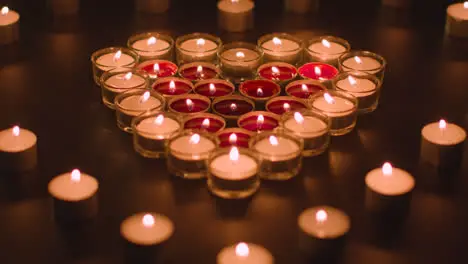 Romantic Red And White Candles In the Shape Of A Heart On Black Background 3