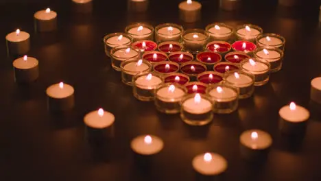 Romantic Red And White Candles In the Shape Of A Heart On Black Background 2