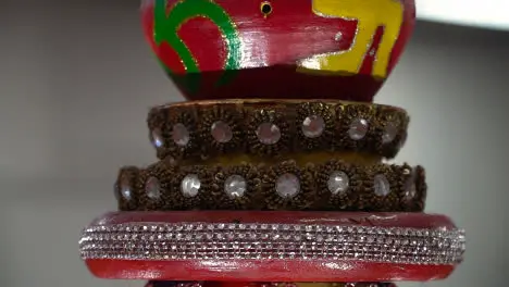 Close Up Of Turning Hindu Lamp With Om And Swastika Symbols During Havan Ceremony