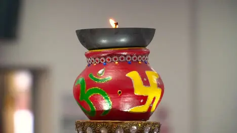 Turning Hindu Lamp With Om And Swastika Symbols During Havan Ceremony