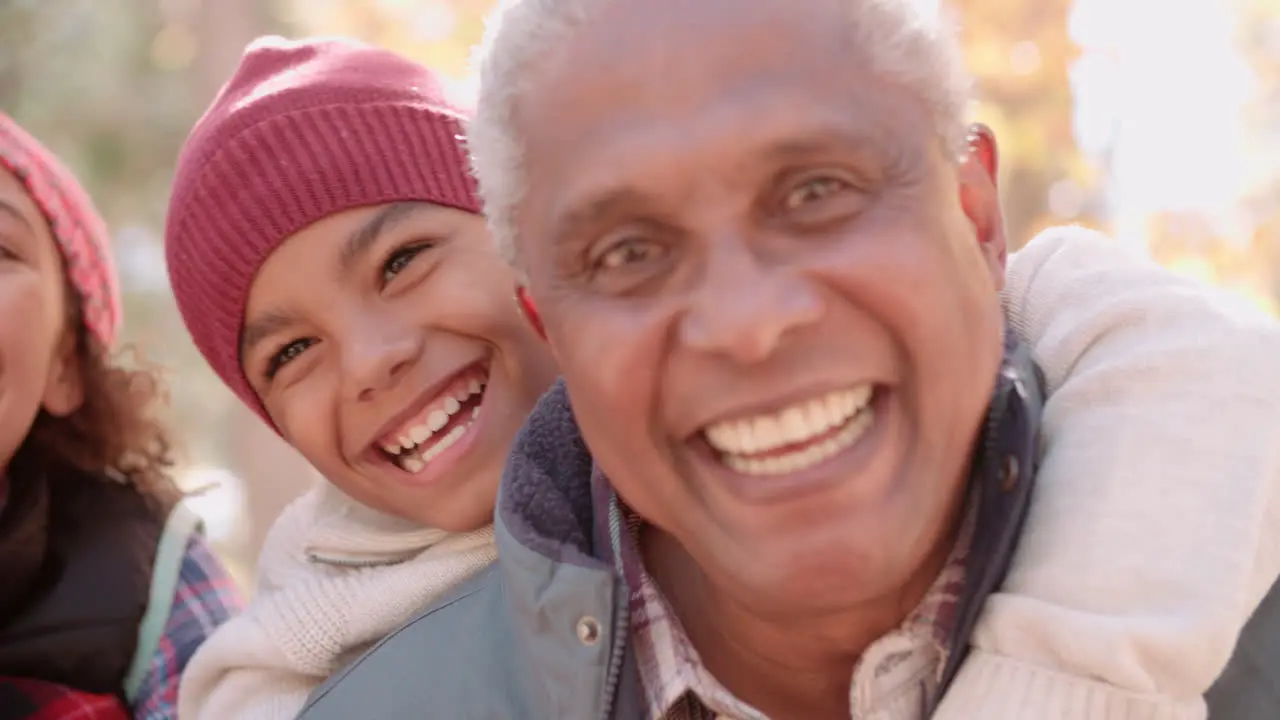 Smiling African American grandparents with grandchildren close up