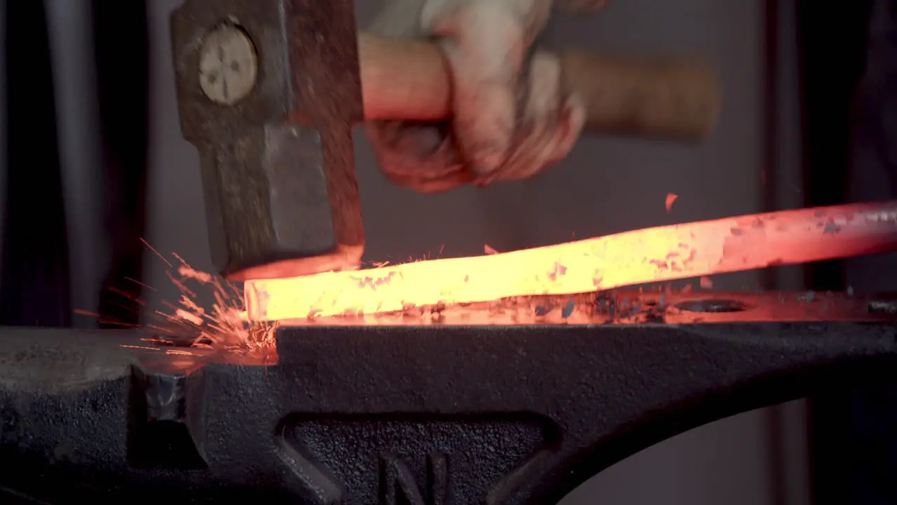 Hammering Red Hot Metal On An Anvil