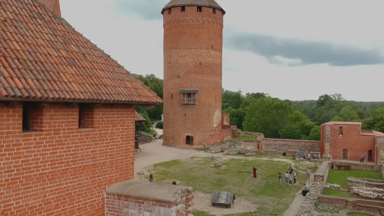 Aerial shot going down focused on the main tower of Turaida s Castle in Latvia