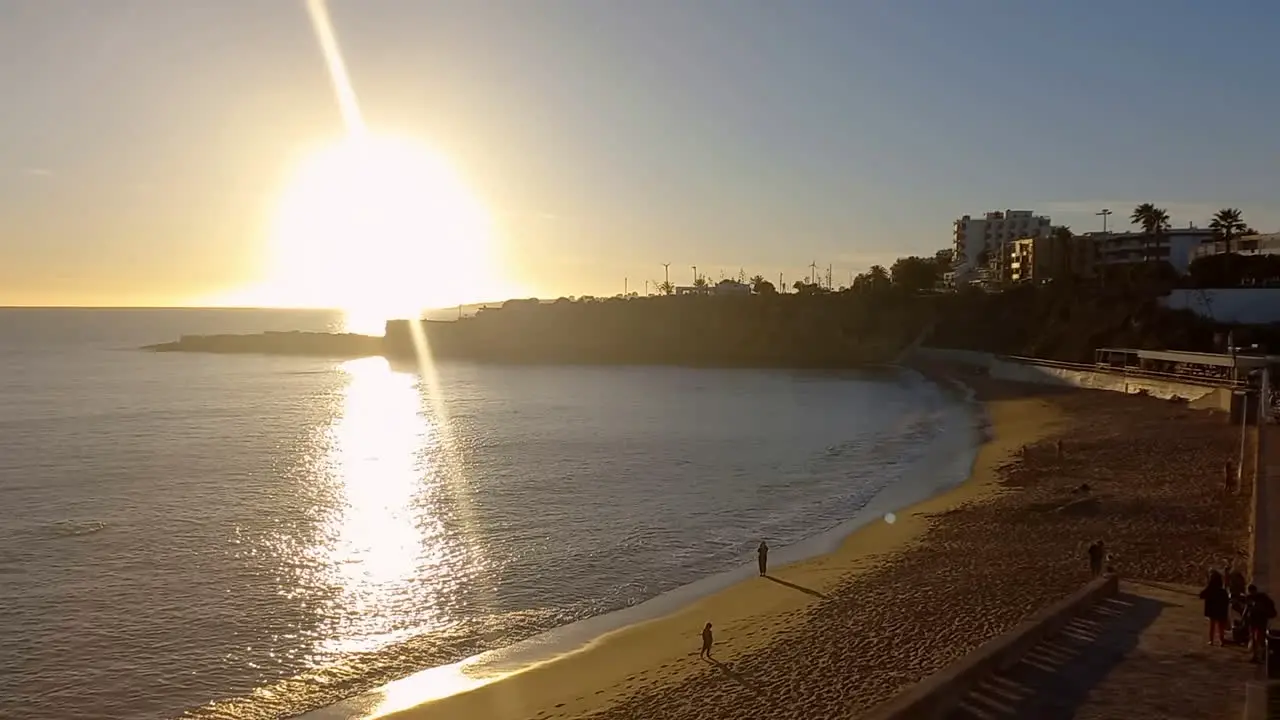 Sunset on São Pedro beach with the calm sea waters transmitting a good tranquility