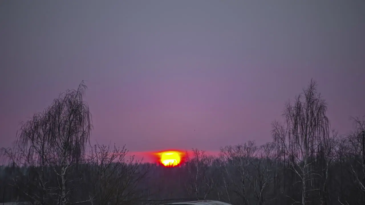 Inspiring red sunset bellow grey cloudscape rural landscape fusion time lapse