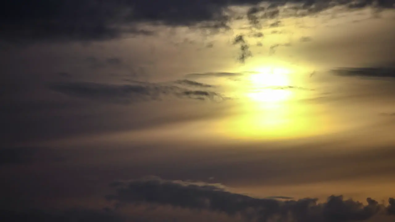 Stunning Dawn Scenery With Warm Sun Rising Through Gray Clouds In The Sky