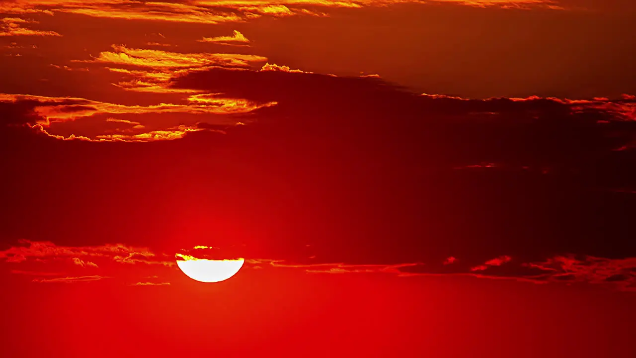 Close up view of sunrise in orange sky in timelapse