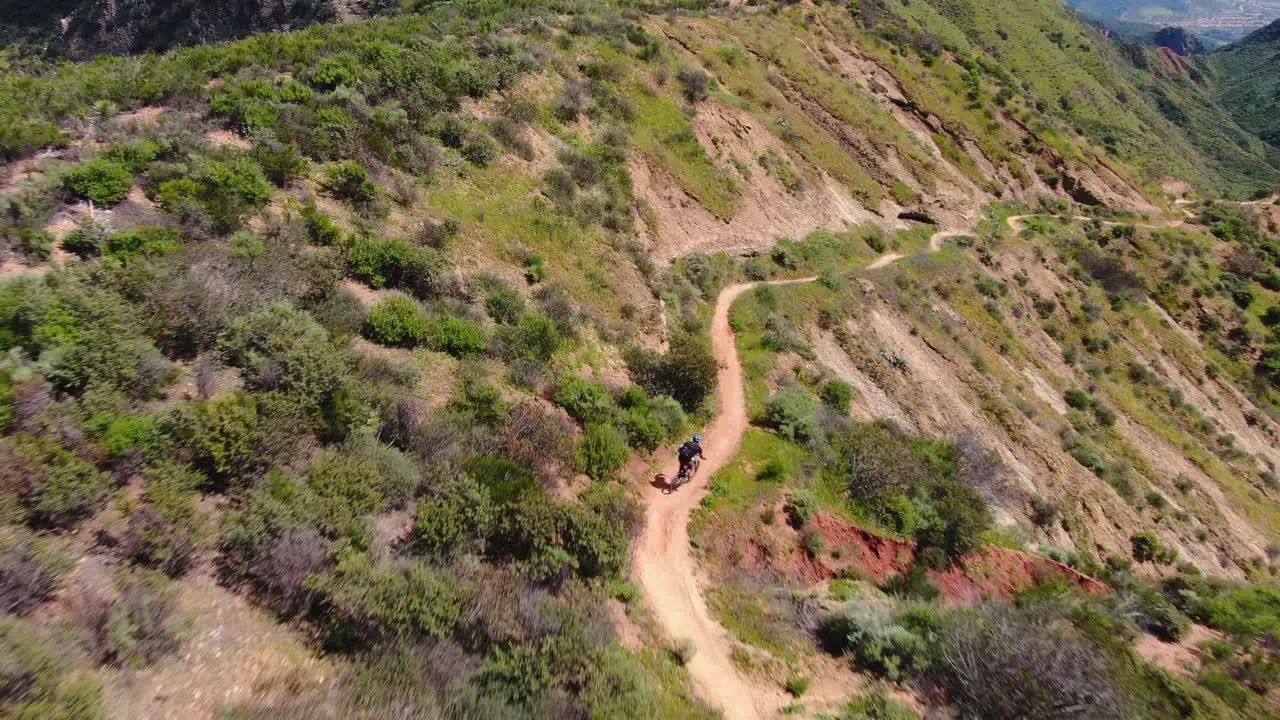 Drone shot of mountain biker riding a trail in Orange County