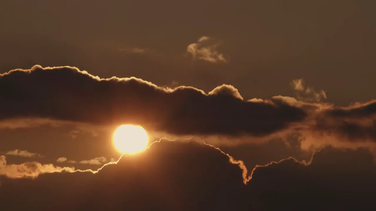 A beautiful sunset beyond the clouds static wide shot