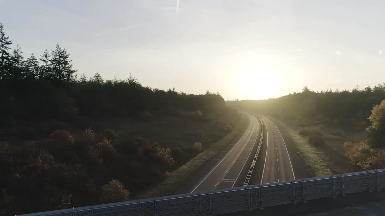 Drone shots of mountainbiker riding over highway