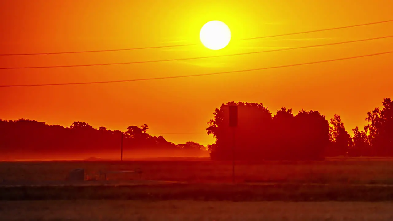 View of red sun rising in timelapse