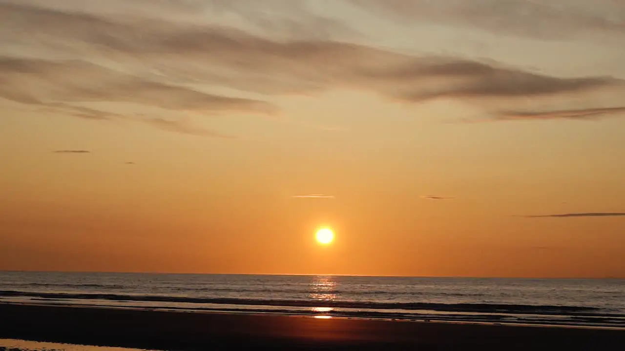 Man running with guitar in back sand beach at sunset-31