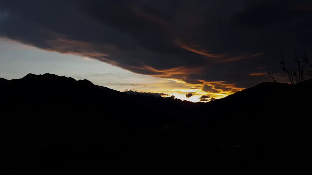 Fiery Sunset Sky Over Mountain In Silhouette Stunning View time lapse