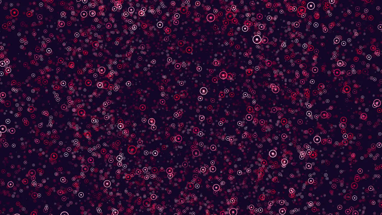 Bold red dot pattern on dark background in circular formation