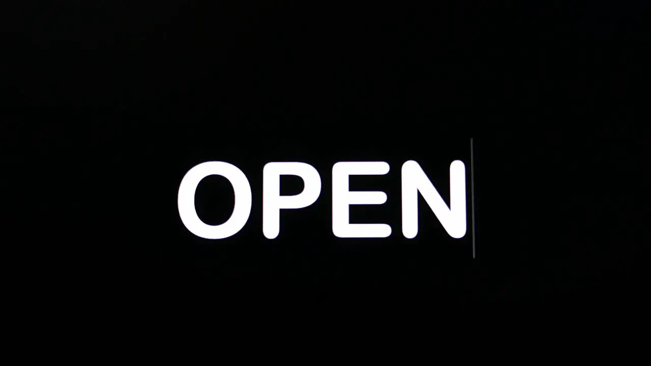 Text written on black screen with the word Open in white