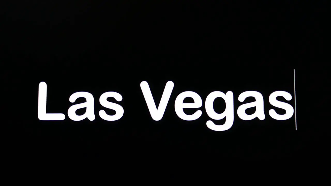 Text written on black screen with the word Las Vegas in white