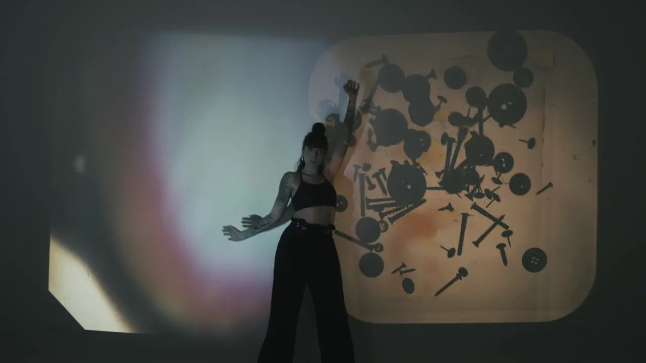 Woman dancing as backgrounds change through acetates telling a captivating story