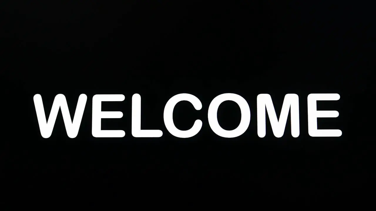 Typography appearing on the screen on a black background with the word welcome