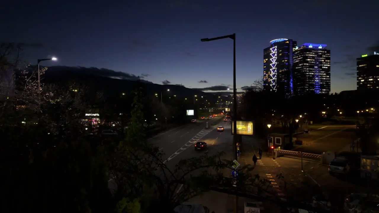 car traffic at 'Bulgaria Boulevard' at night high-rise buildings on the right