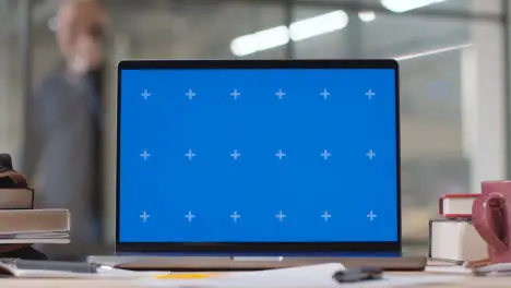 Blue Screen Laptop on Desk In University College Or School 2