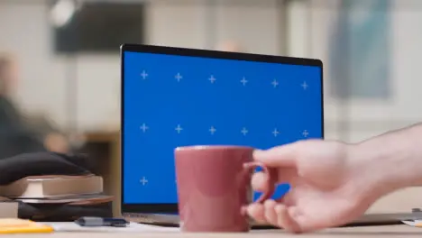 Blue Screen Laptop on Desk In University College Or School 4