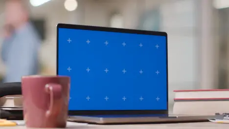 Blue Screen Laptop on Desk In University College Or School 5