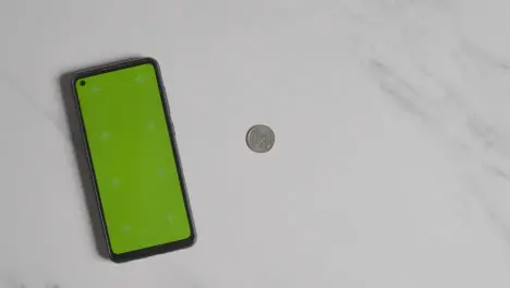 Overhead Currency Shot Person Grabbing Euro Notes And Coins Next To Green Screen Mobile Phone