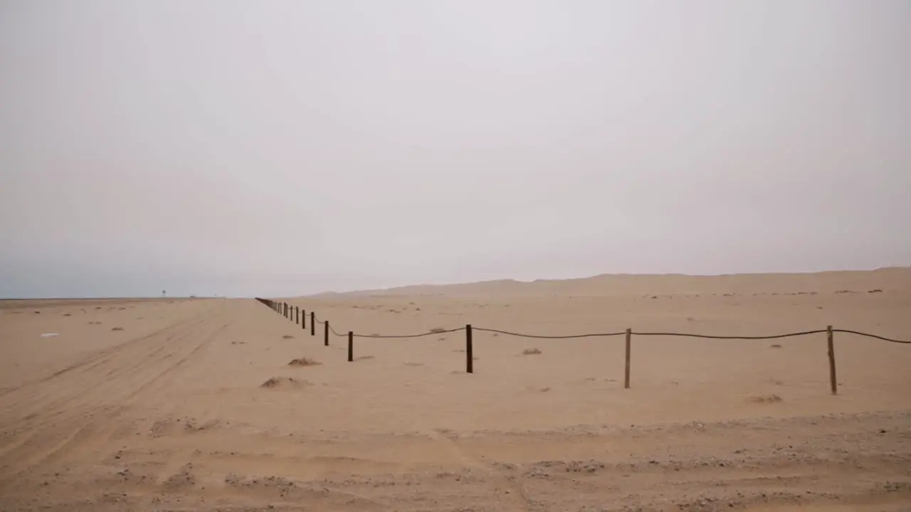 A conservation area with desert dunes in the Namib desert next to a busy road between Swakopmund and Walvisbay in Namibia