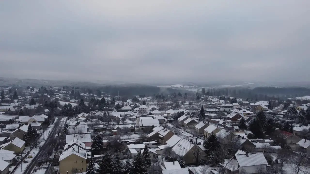 Szenna town with snow on a early misty morning