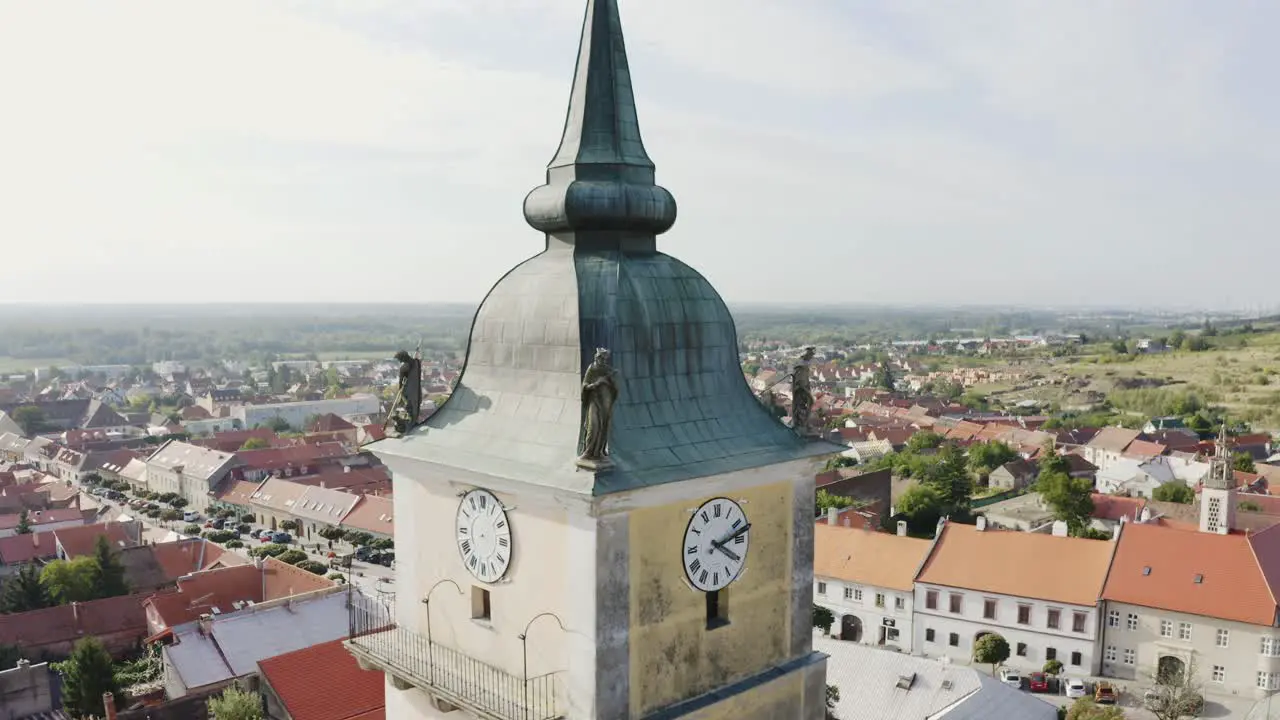 Statue of saint on the church tower aerial shot