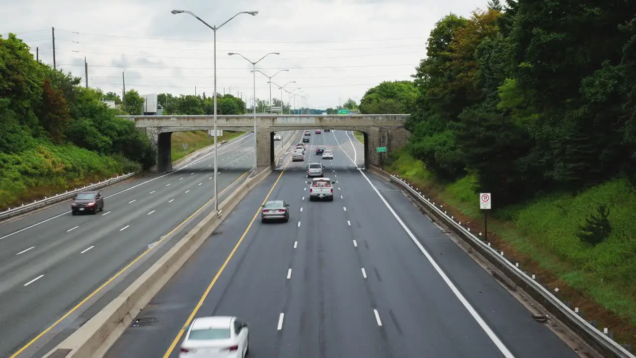 Shot of low traffic on highway from bridge