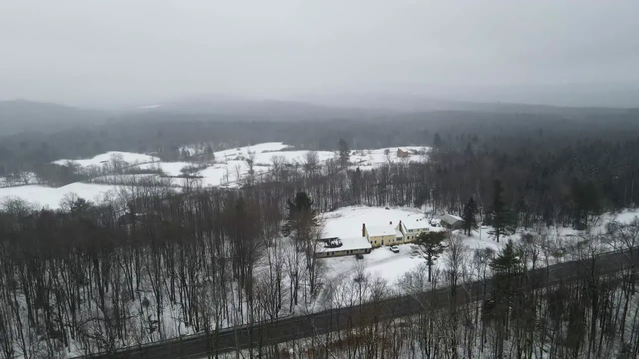 Winter in Vermont Snowy landscapes leafless trees tranquil road and cozy home under cloudy skies