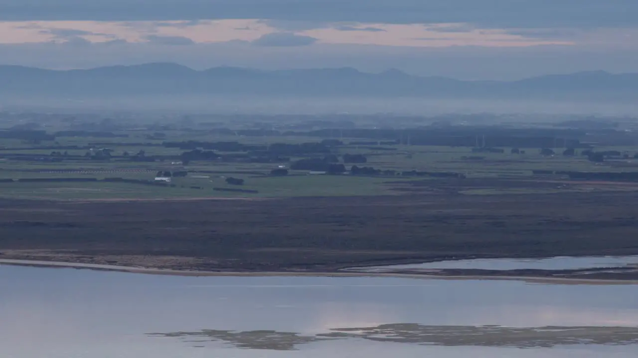 New Zealand plateau with ocean and sky reflection during sunset