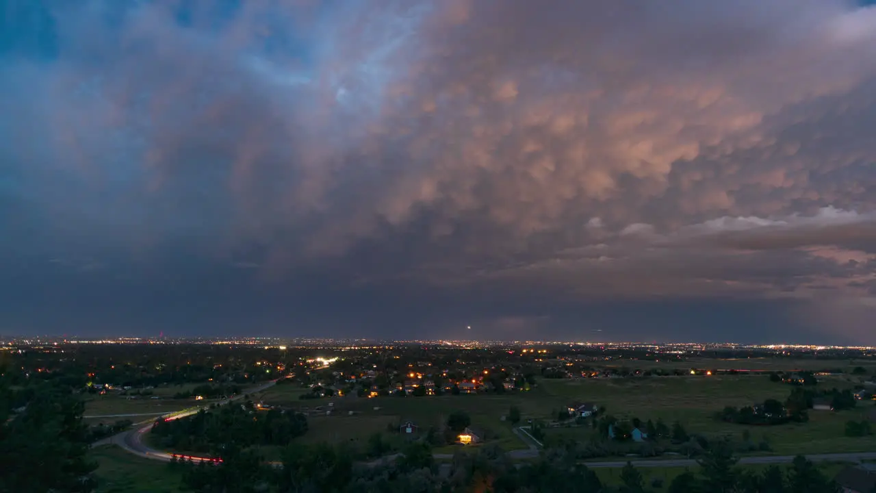 A sunset turns into darkness as a storm rolls over Fort Collins Colorado