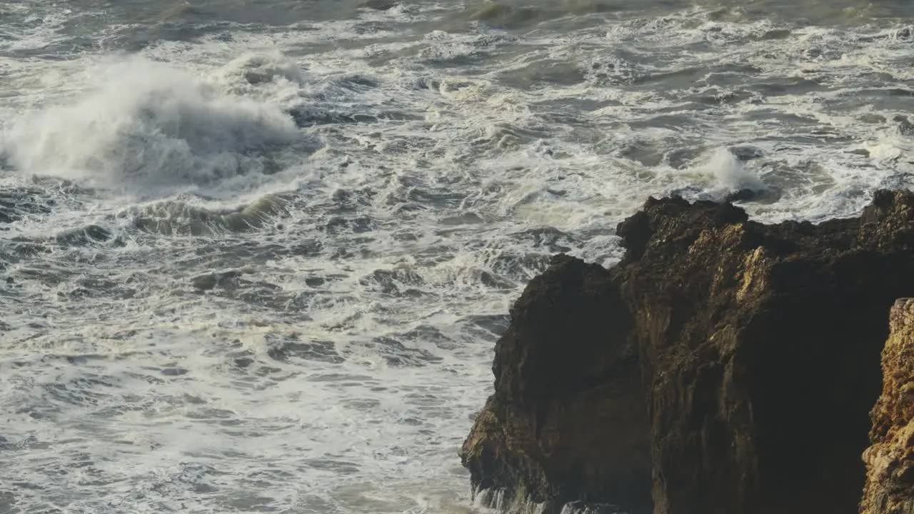 Rough stormy sea and cliffs on Nazare Portugal coast power of nature stable bad weather view