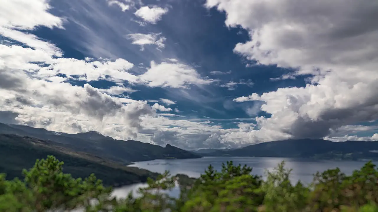 White clouds whirl and flow carried by the strong wind above the Hardanger