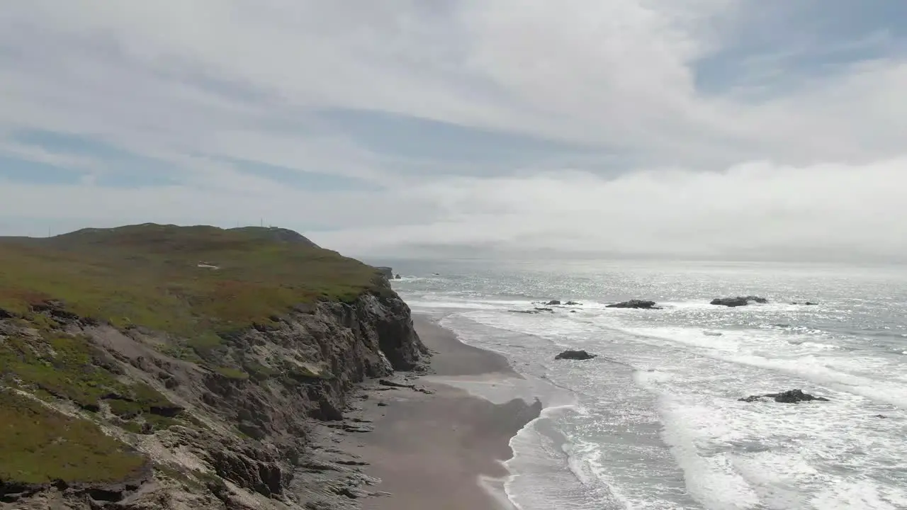 Coastal cliffs to the ocean drone shot