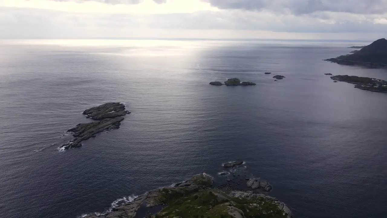 Aerial sunset over the Norwegian sea from rocky Reine village coast Norway