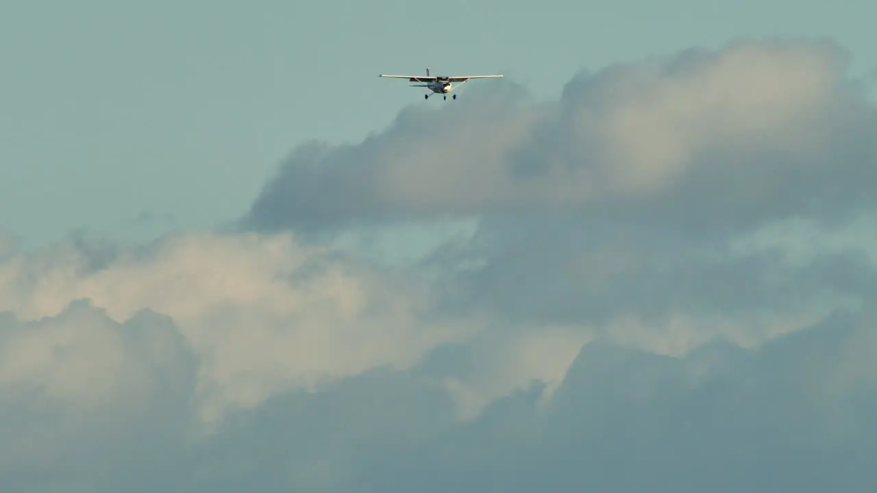 Cessna-172 Plane Flying Against Cloudy Sky Background In Canada