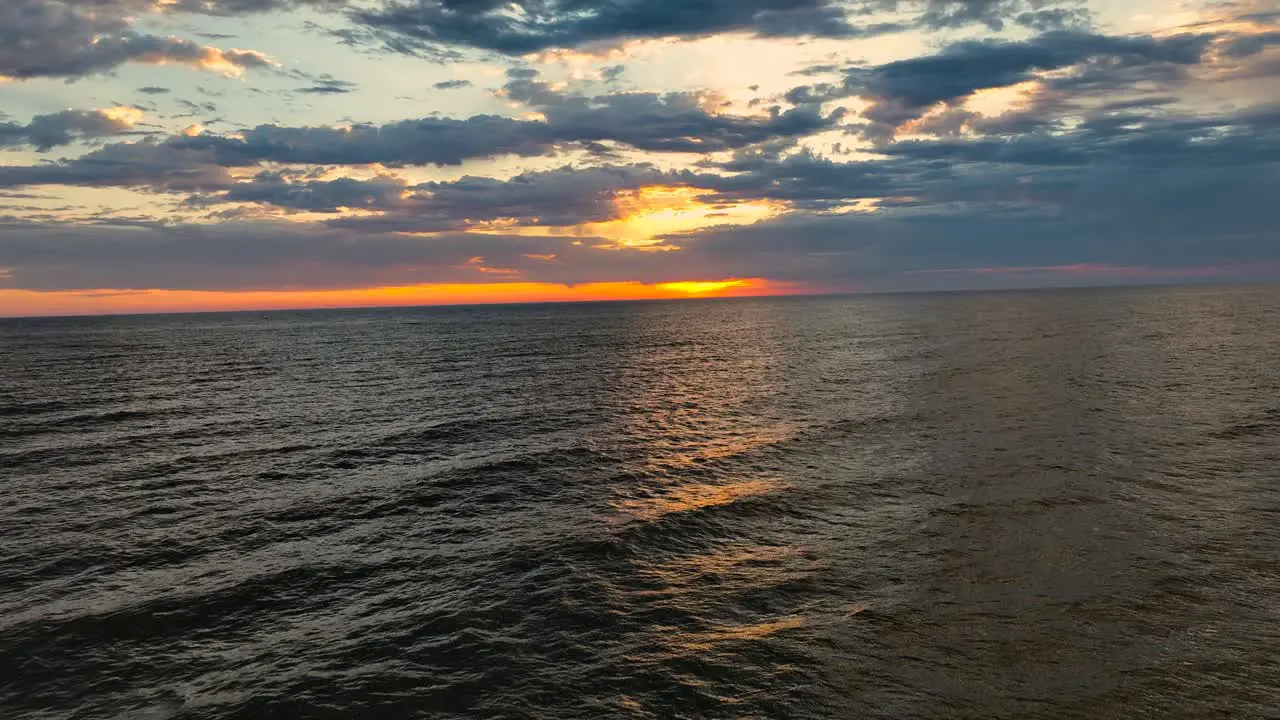 A gorgeous sunset over choppy water during high winds