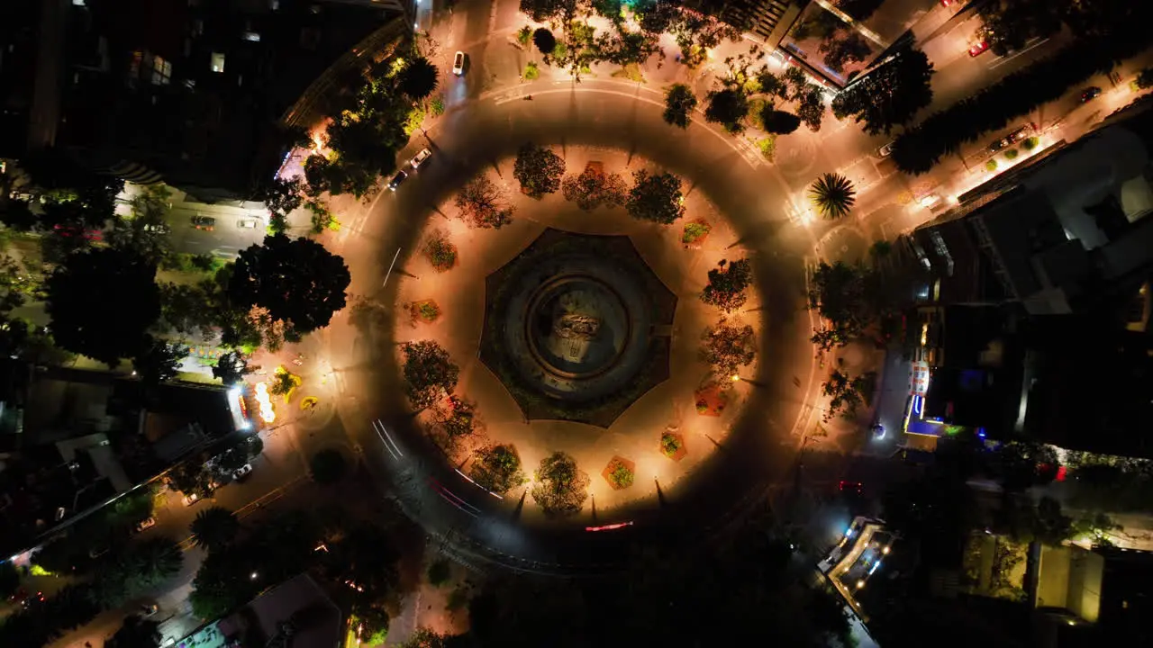 Aerial hyperlapse rotating above the night lit Cibeles fountain in Mexico city