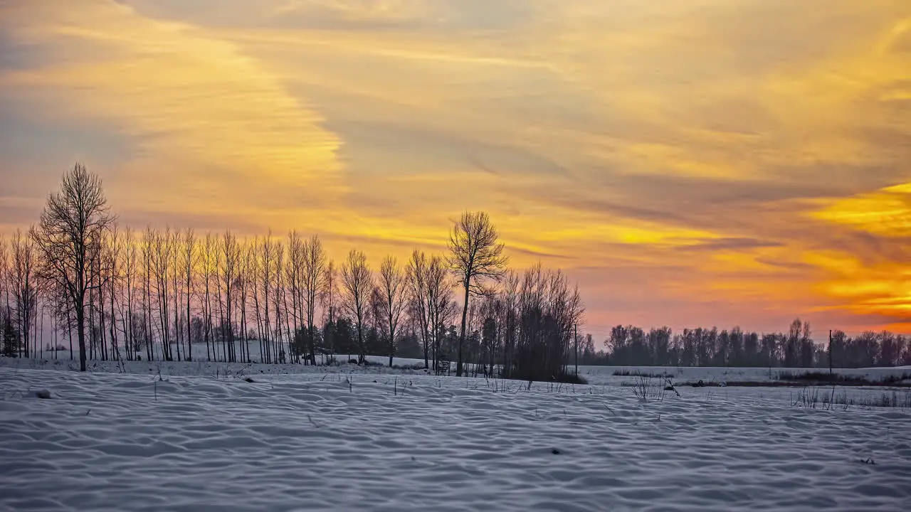 Golden sunset and twilight over a winter wilderness landscape time lapse