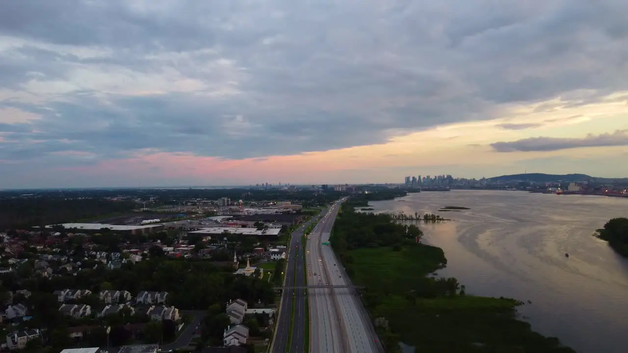 Dramatic sunset as highway leads to skyscrapers on horizon Montreal