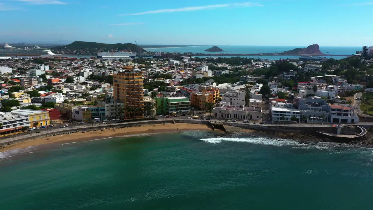 Aerial tracking shot of the coast of Mazatlan sunny day in Sinaloa Mexico