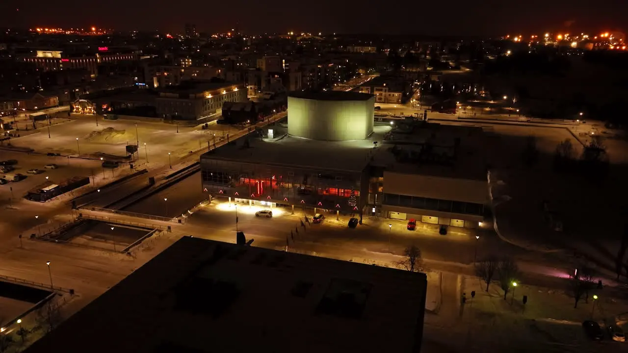 Aerial view tilting toward the Oulu Theatre winter evening in North Ostrobothnia Finland