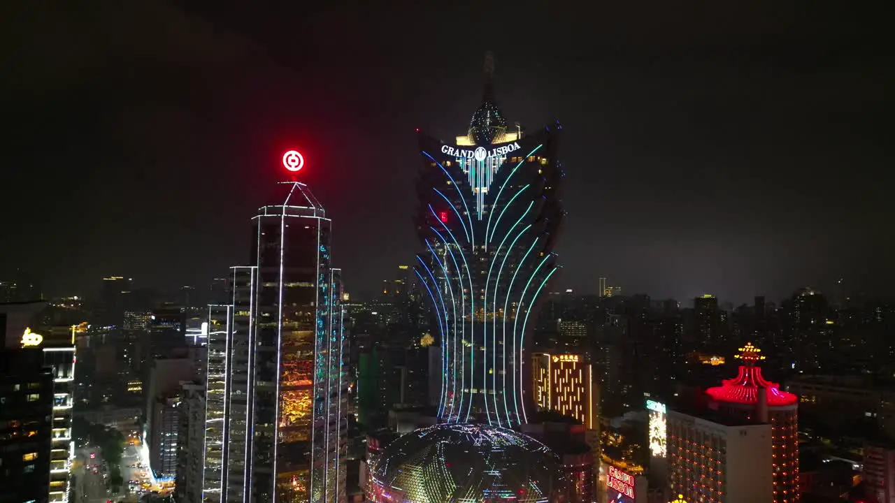 Aerial view approaching Grand Lisboa Hotel at night