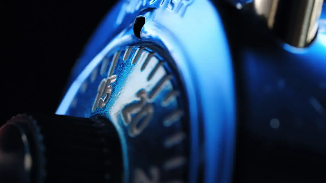 Opening a combination padlock at nighttime close up isolated